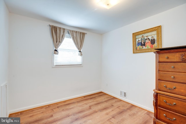 unfurnished room with light hardwood / wood-style floors