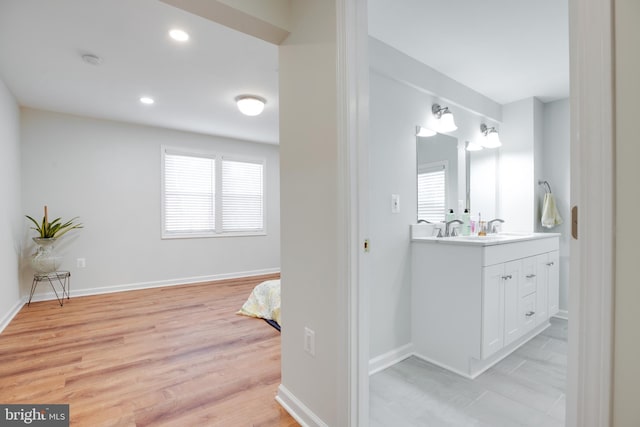 bathroom featuring vanity and wood-type flooring