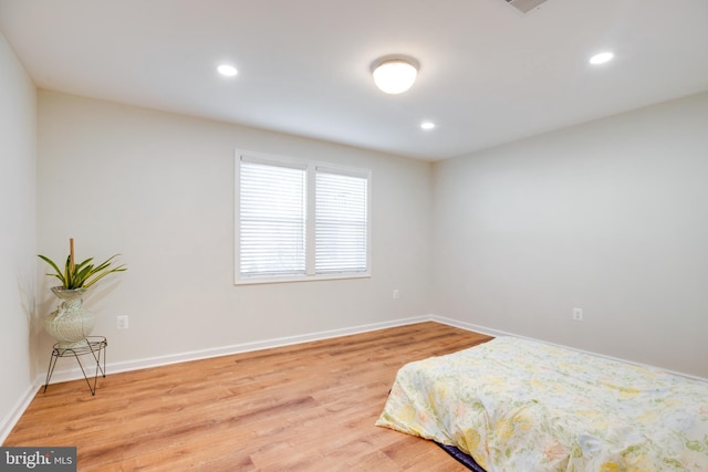 bedroom with light hardwood / wood-style floors