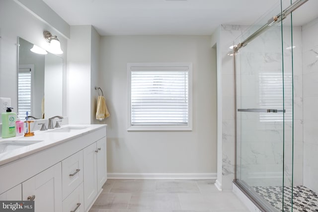 bathroom featuring vanity and an enclosed shower