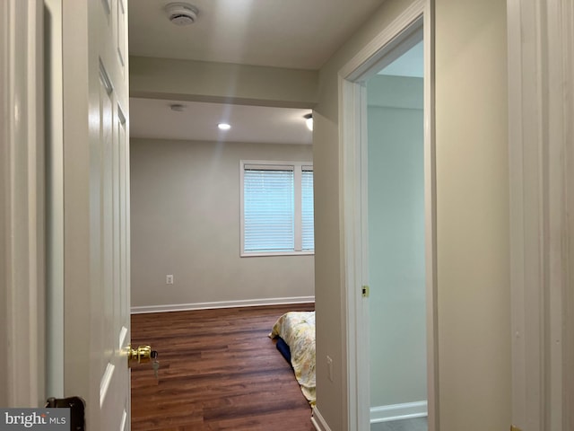 hallway with dark hardwood / wood-style floors