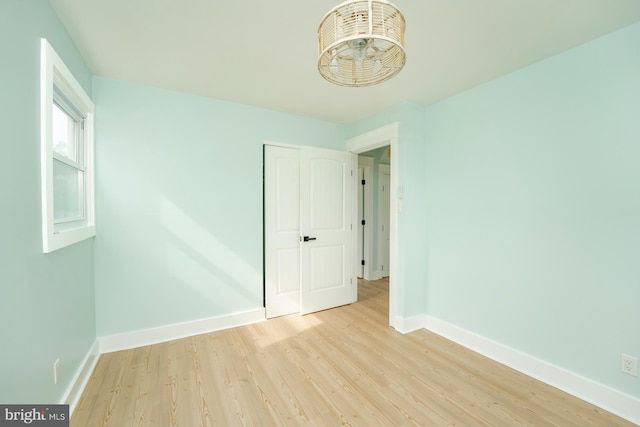 empty room with light hardwood / wood-style floors