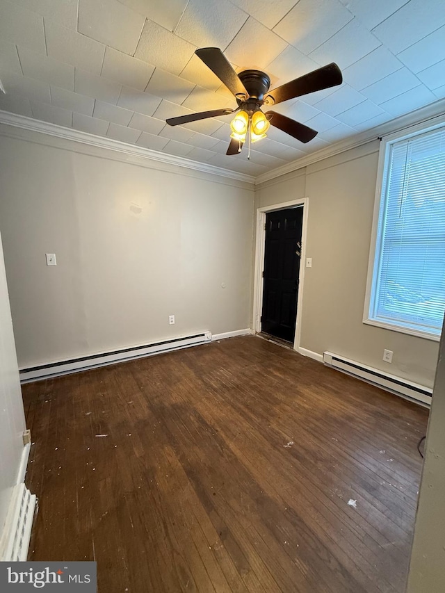 unfurnished room with dark hardwood / wood-style floors, ceiling fan, ornamental molding, and a baseboard radiator