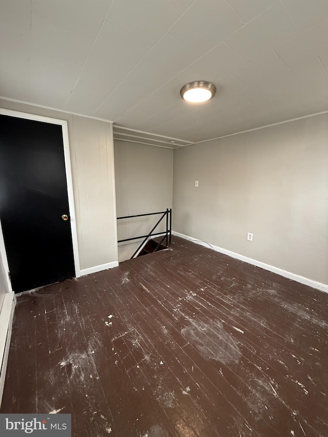 spare room featuring dark hardwood / wood-style floors