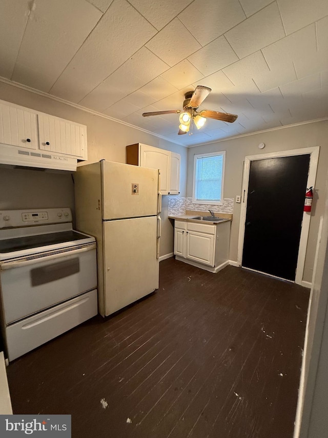 kitchen with white cabinets, dark hardwood / wood-style floors, white appliances, and exhaust hood