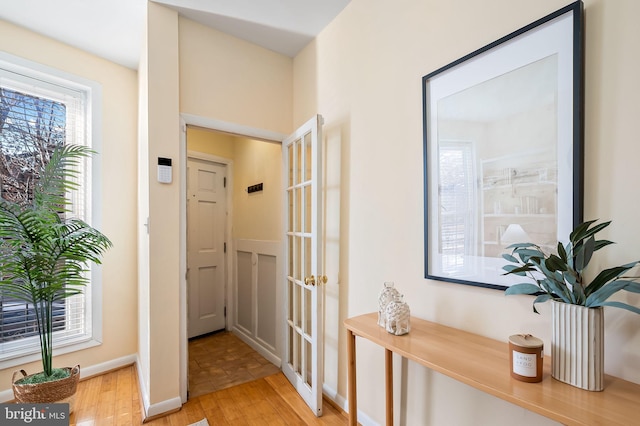 hallway with light hardwood / wood-style flooring