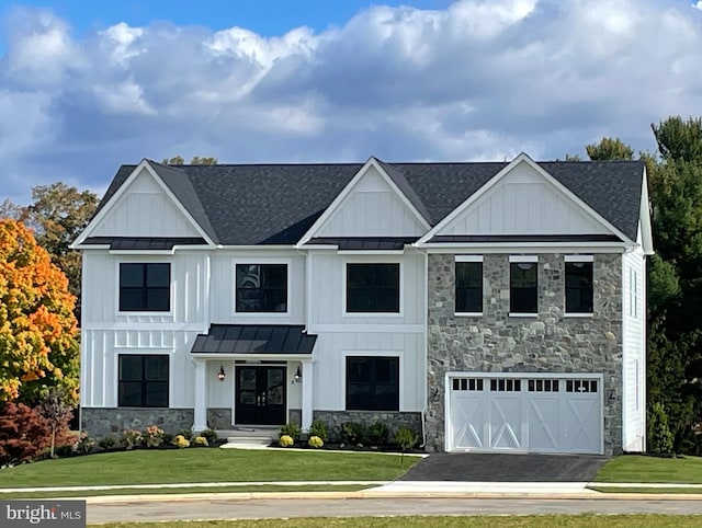 modern inspired farmhouse featuring a front yard and a garage