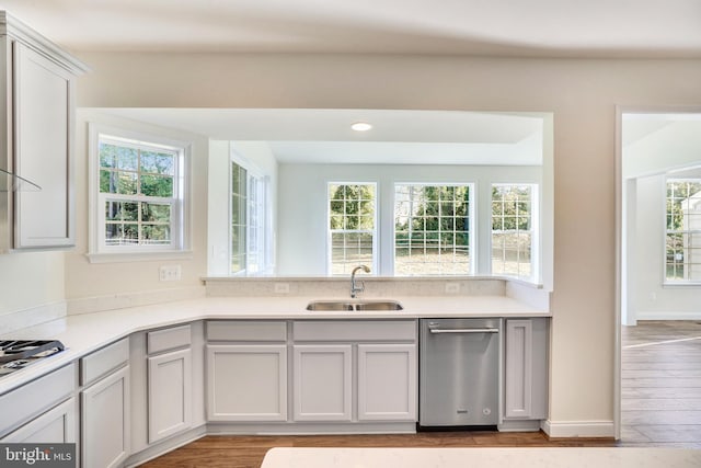 kitchen with dishwasher, sink, white gas stovetop, and light wood-type flooring