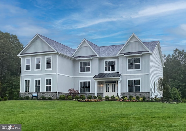 craftsman-style home featuring a front lawn