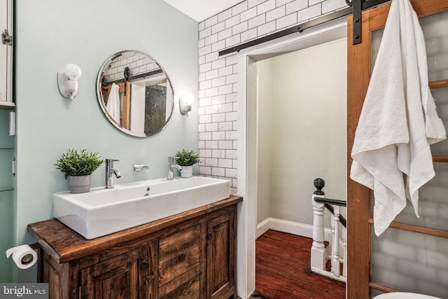 bathroom with vanity and hardwood / wood-style floors