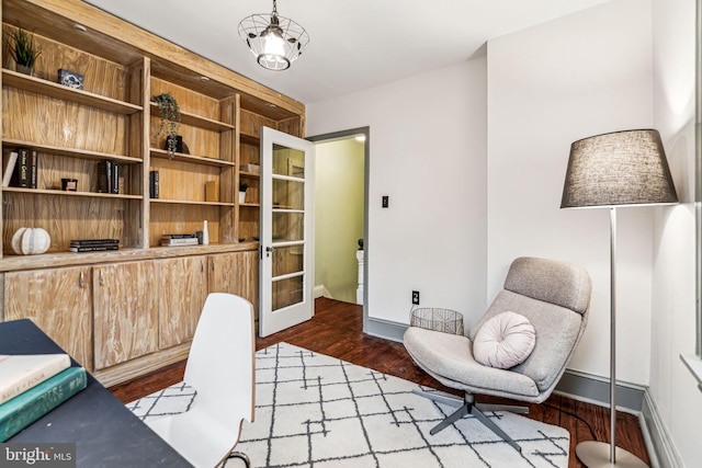 office area with hardwood / wood-style flooring and a chandelier