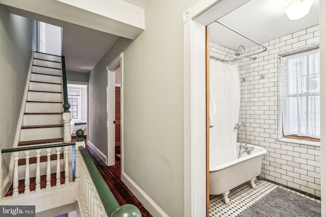 bathroom with shower / bath combo