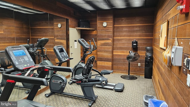 gym featuring wooden walls