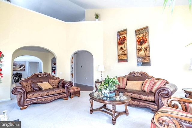 living room with carpet and vaulted ceiling