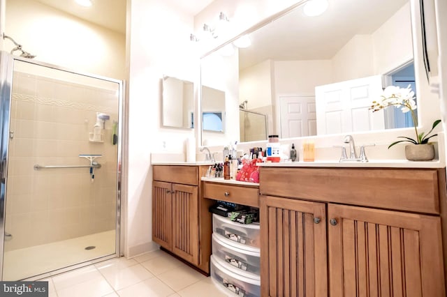 bathroom with vanity, tile patterned floors, and a shower with shower door