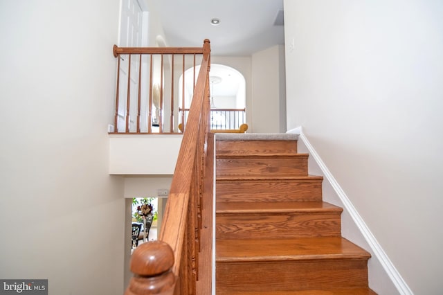 stairway featuring plenty of natural light