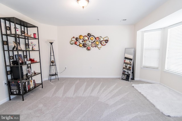 misc room featuring light colored carpet