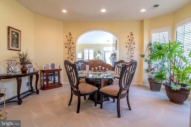 dining room featuring light colored carpet