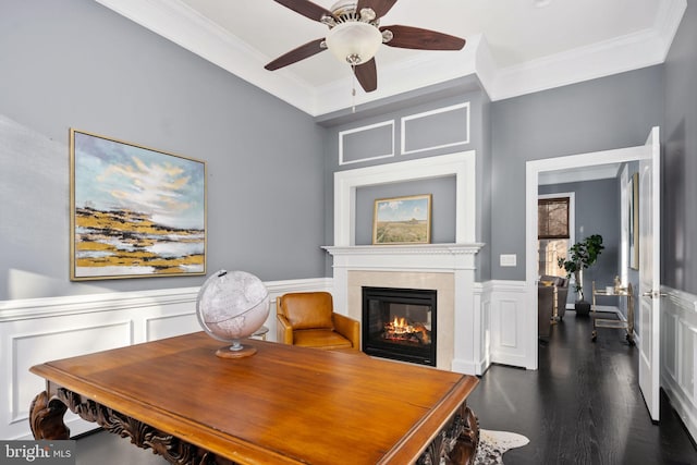 office with ceiling fan, dark wood-type flooring, and ornamental molding