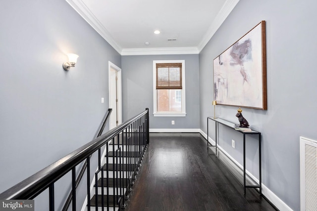 hall featuring dark hardwood / wood-style floors and crown molding