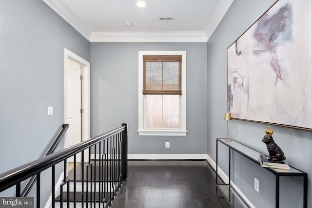 corridor with dark wood-type flooring and ornamental molding