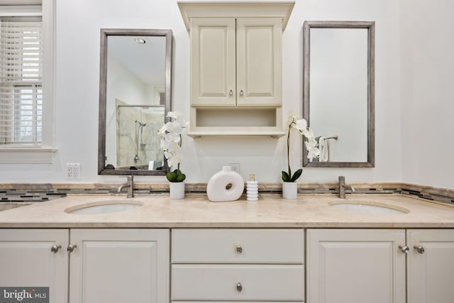 bathroom with vanity and a shower with door