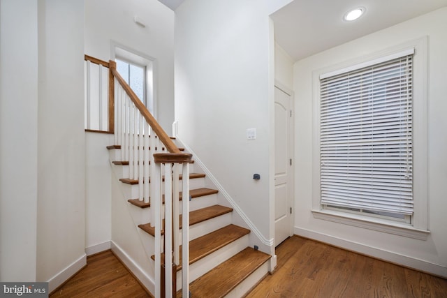 staircase featuring hardwood / wood-style floors