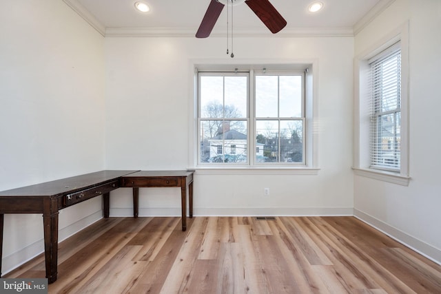 interior space featuring ceiling fan, light hardwood / wood-style flooring, and crown molding