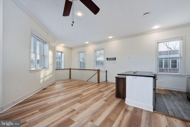 kitchen with ceiling fan, ornamental molding, and light hardwood / wood-style flooring