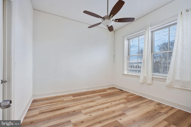 spare room featuring ceiling fan and light hardwood / wood-style floors