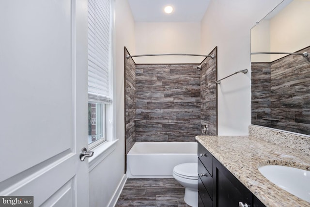 full bathroom with bathing tub / shower combination, vanity, wood-type flooring, and toilet