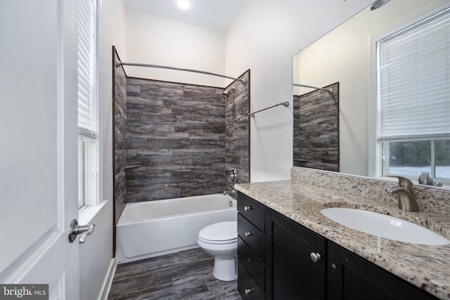 full bathroom with vanity, wood-type flooring, bathtub / shower combination, and toilet