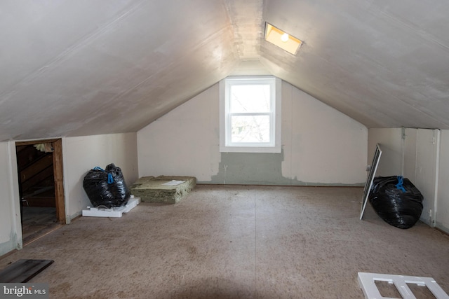 additional living space with vaulted ceiling