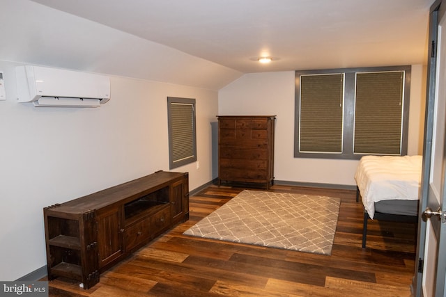 bedroom featuring lofted ceiling, dark hardwood / wood-style flooring, and an AC wall unit