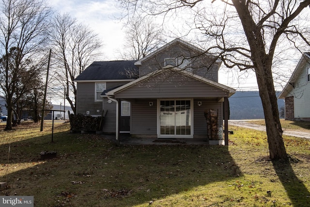 bungalow-style house featuring a front yard