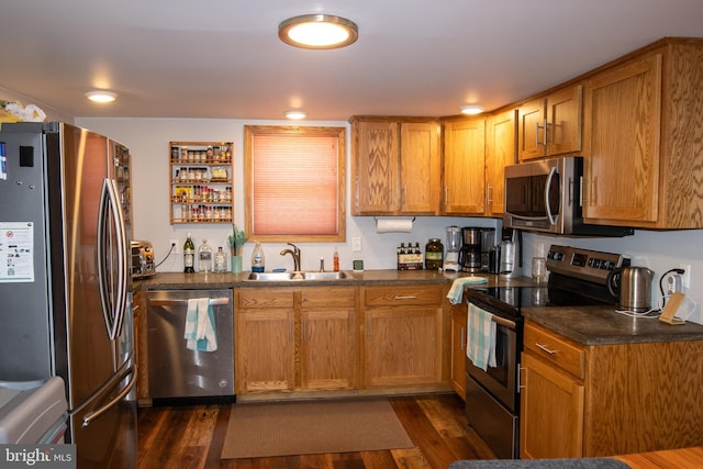 kitchen featuring dark hardwood / wood-style floors, sink, and stainless steel appliances