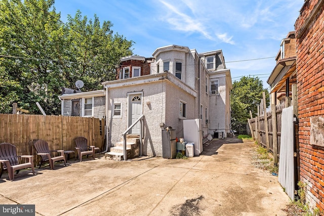 back of property with a patio area