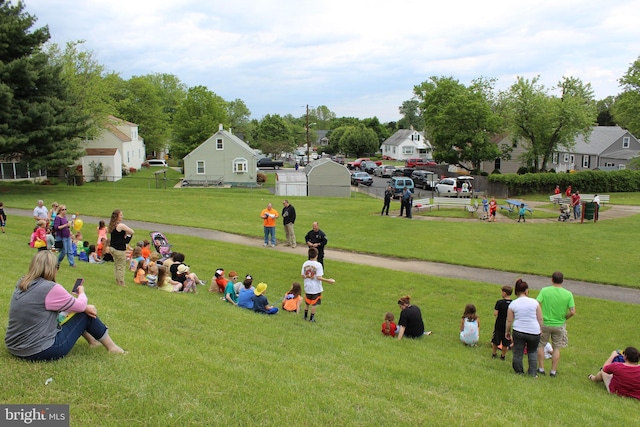 view of property's community with a yard