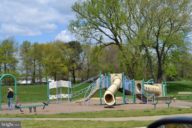 view of jungle gym with a lawn