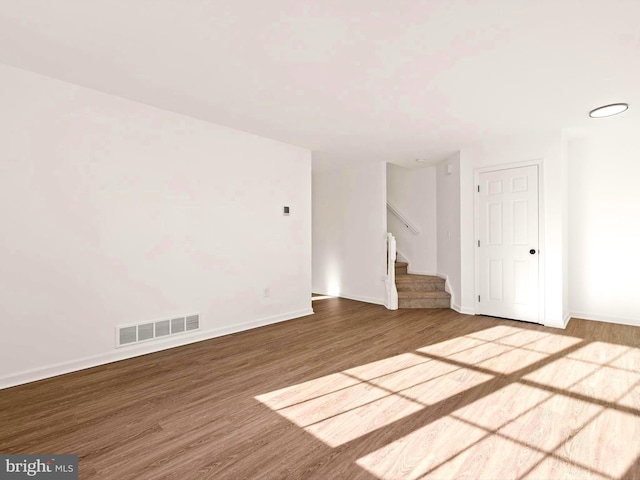 spare room with wood-type flooring