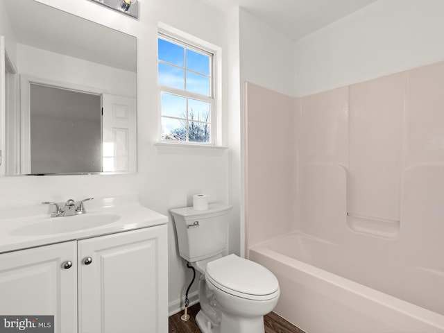 full bathroom featuring vanity, shower / bathtub combination, toilet, and wood-type flooring