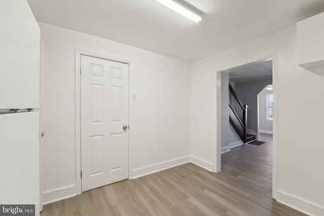 spare room featuring light hardwood / wood-style flooring