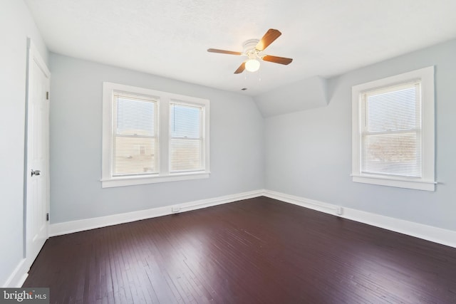 bonus room featuring dark hardwood / wood-style flooring, a wealth of natural light, lofted ceiling, and ceiling fan