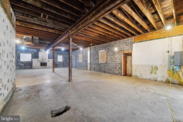 basement with brick wall