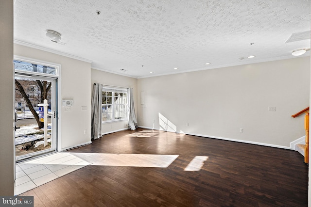 entryway featuring a textured ceiling, light hardwood / wood-style floors, and crown molding