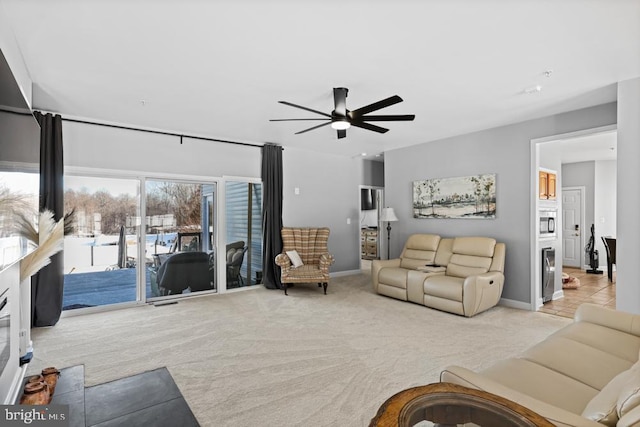 carpeted living room featuring ceiling fan and wine cooler