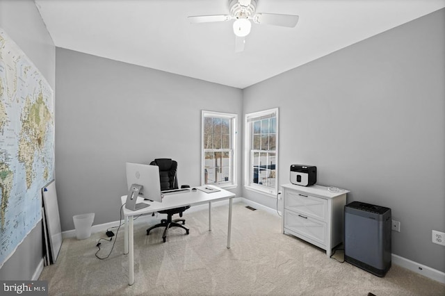 office featuring ceiling fan and light carpet