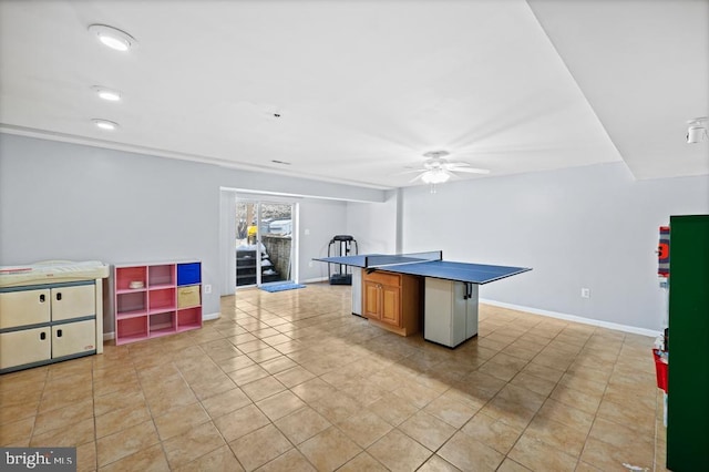 playroom with ceiling fan and light tile patterned flooring