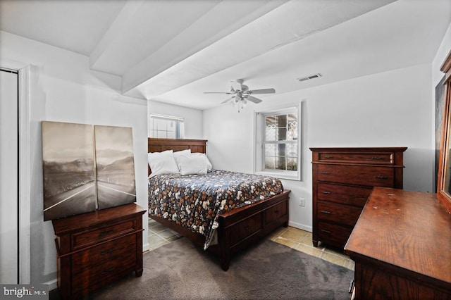 bedroom with ceiling fan and light tile patterned floors