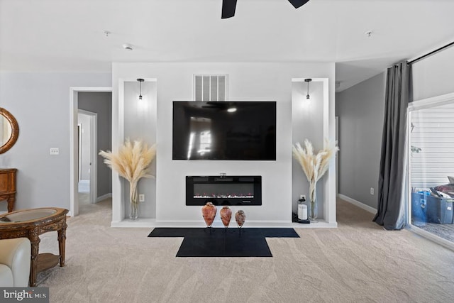 living room featuring light colored carpet and ceiling fan